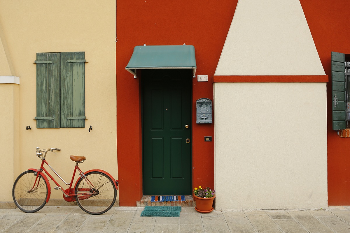 The bike leaning on the right wall!