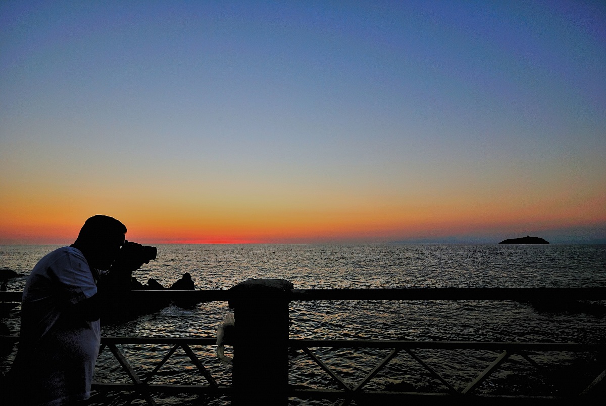 Photographer at sunset