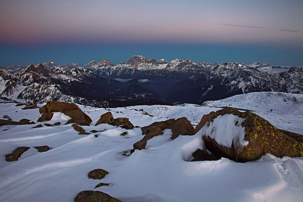 the moon rises in the blue