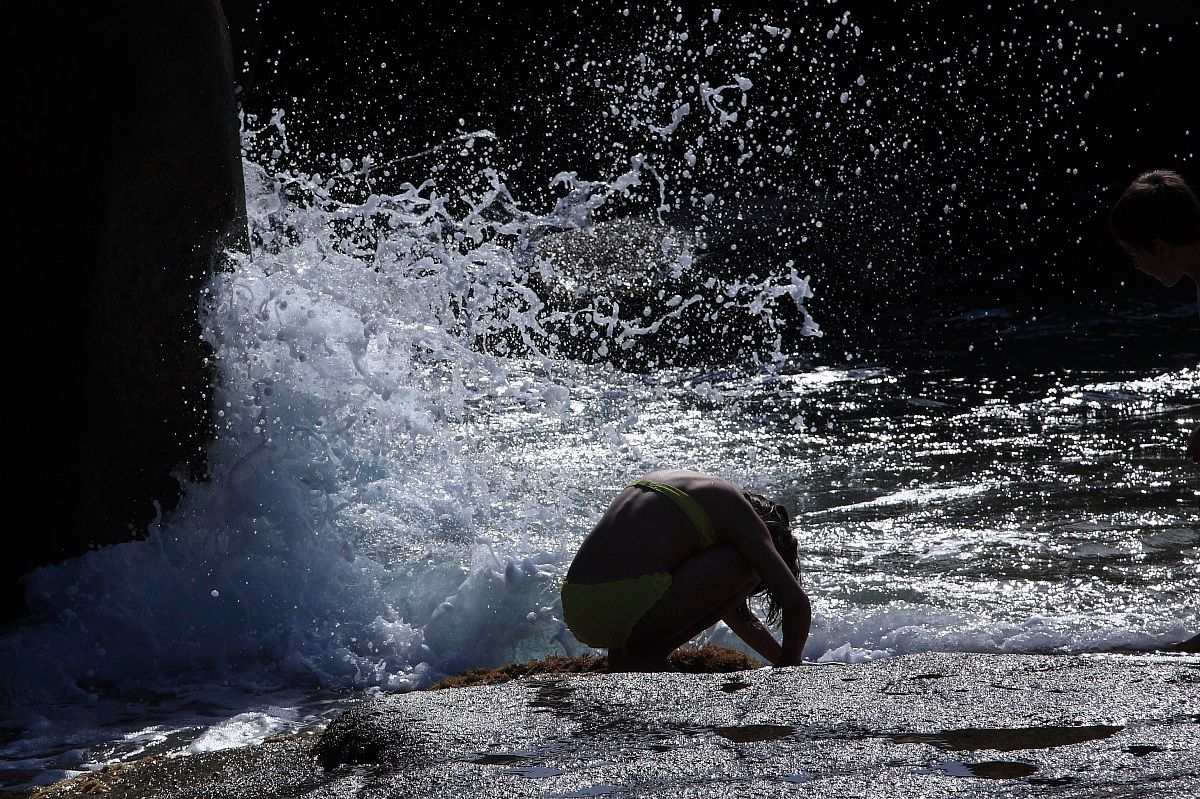 Girl playing with seashells