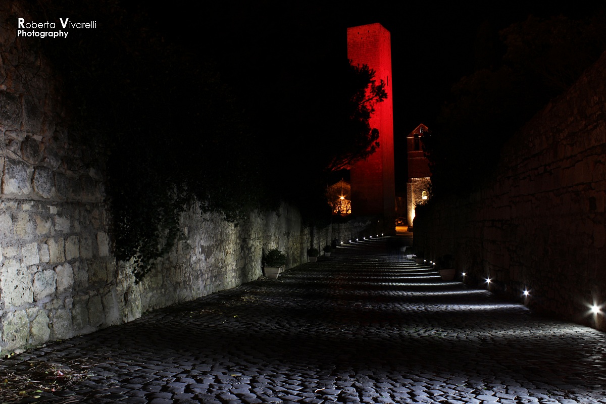 Tower and red light beams.