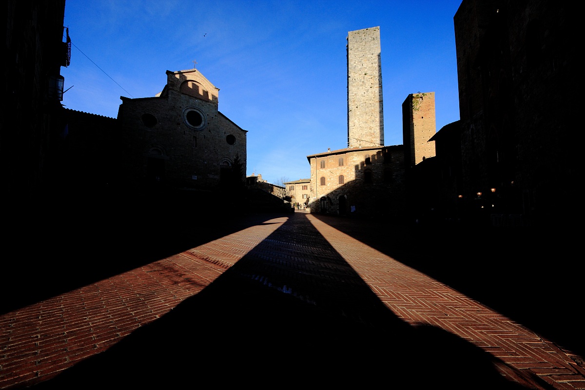 Play of light in Piazza del Duomo - San Gimignano
