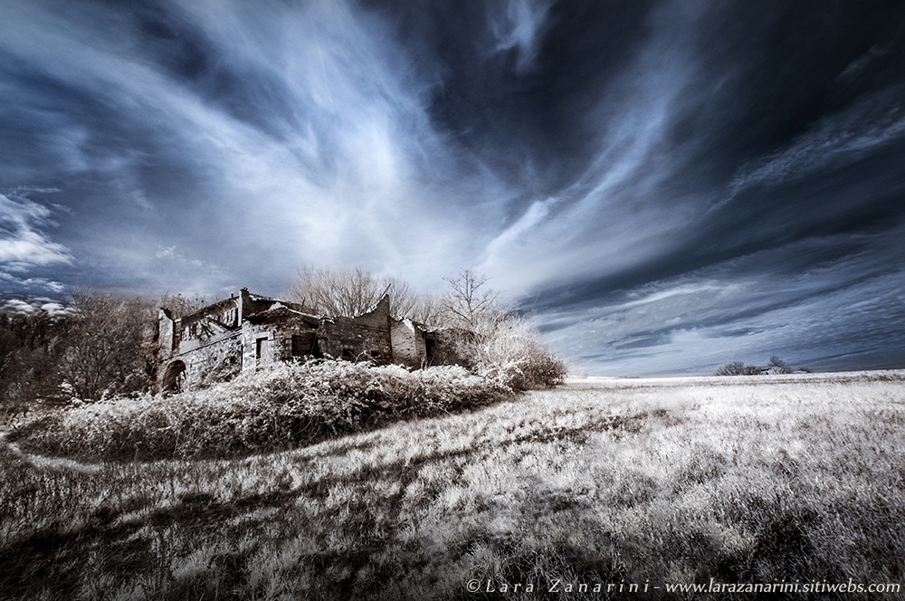 light beams glitter in blue near the gates of antiquity