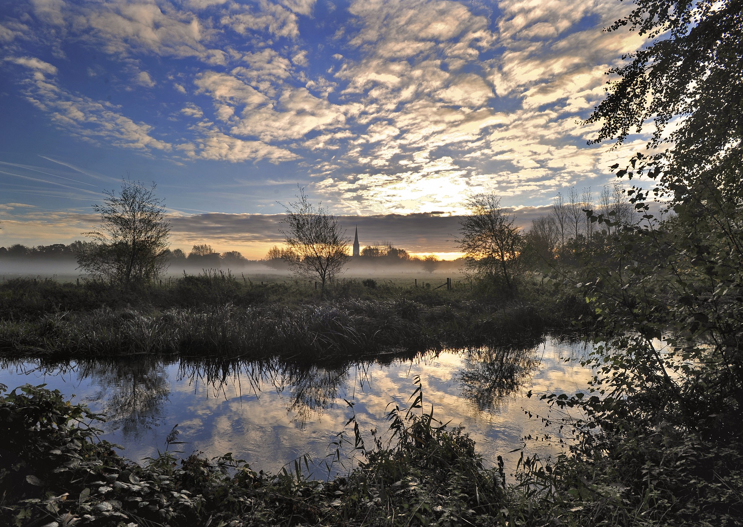 Salisbury Cathedral over the misty Watermeadows