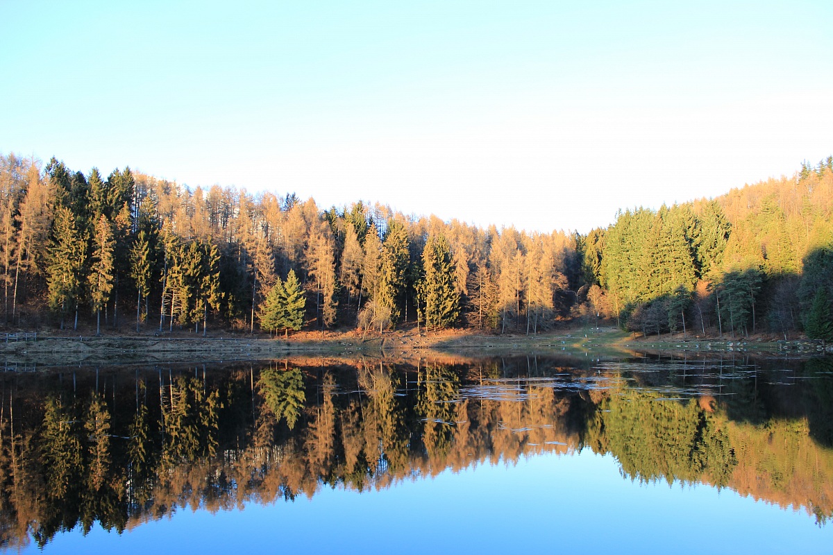 an overexposed sky and reflection becomes perfect