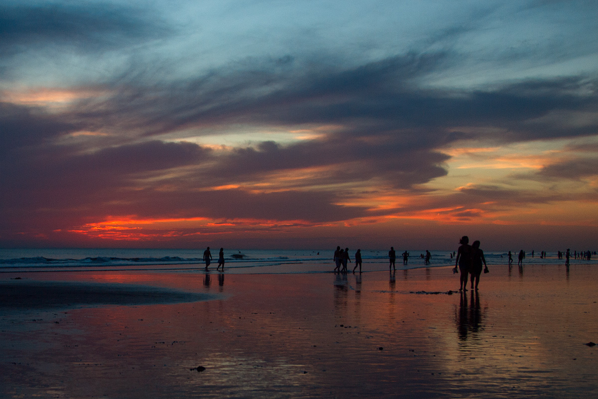 Sunset on the beach crowded.