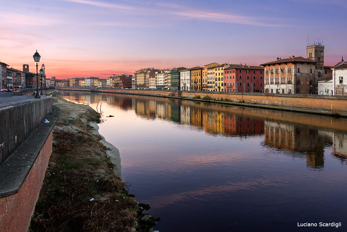 Pisa and the Arno river at sunset