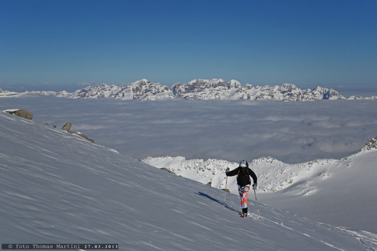 Ski mountaineering above the clouds