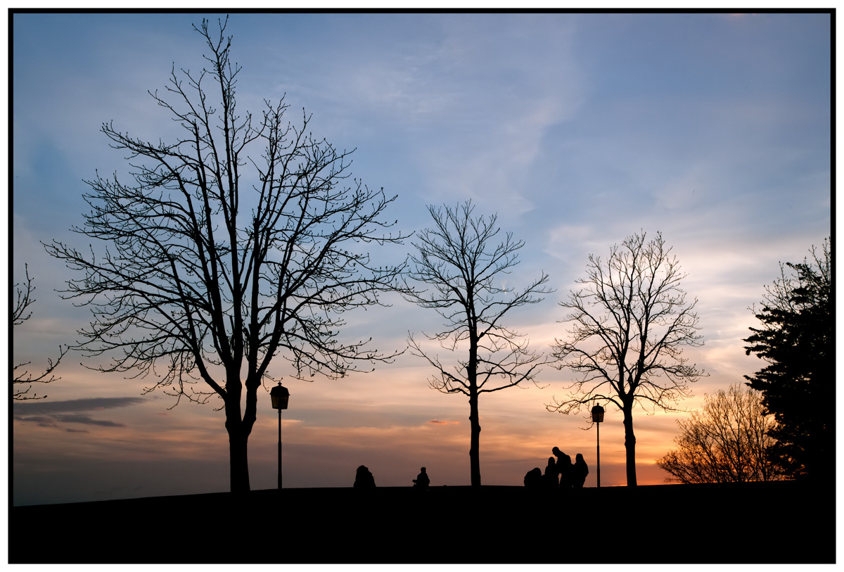 family walking at sunset on the walls