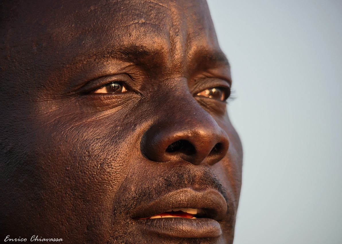 In his eyes the light of a sunset in Africa