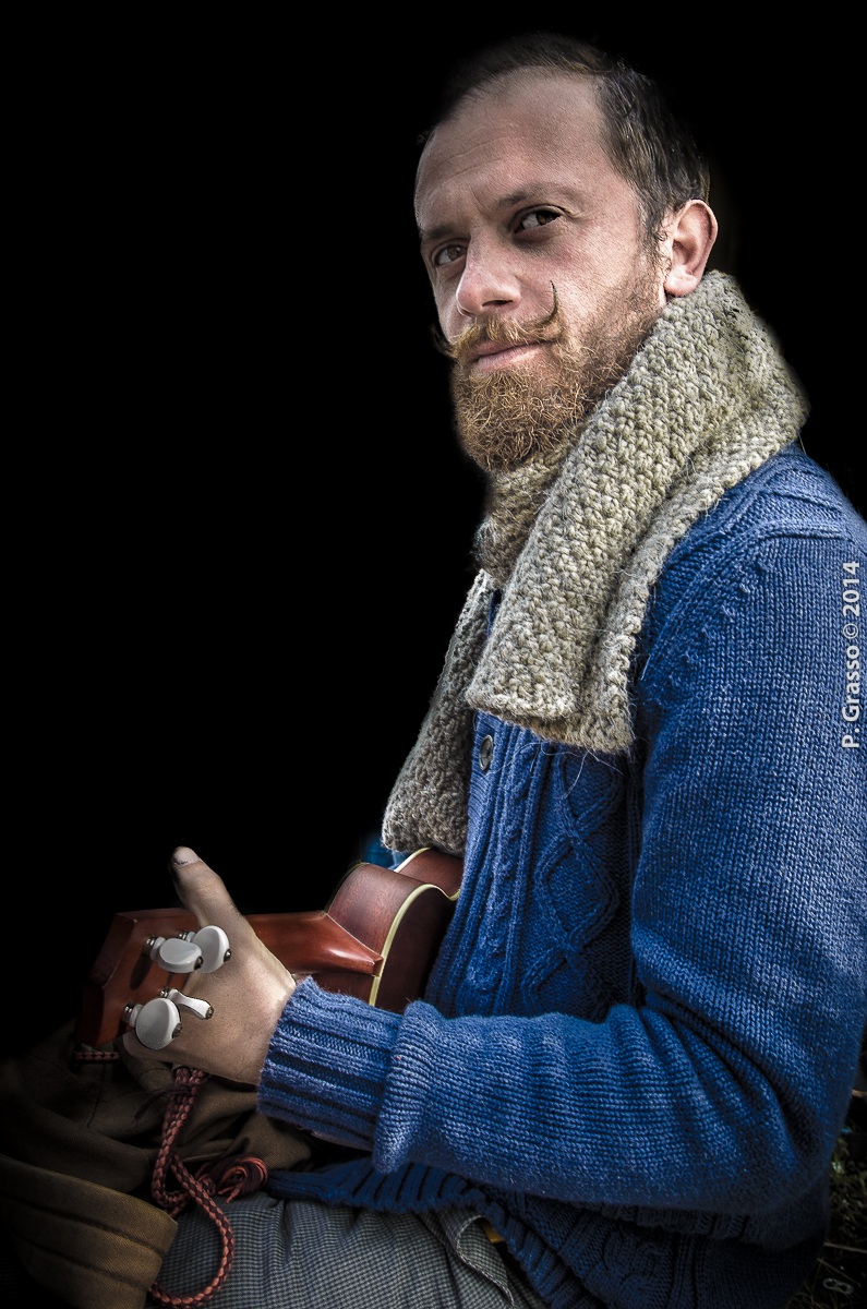 man with a mustache and ukulele