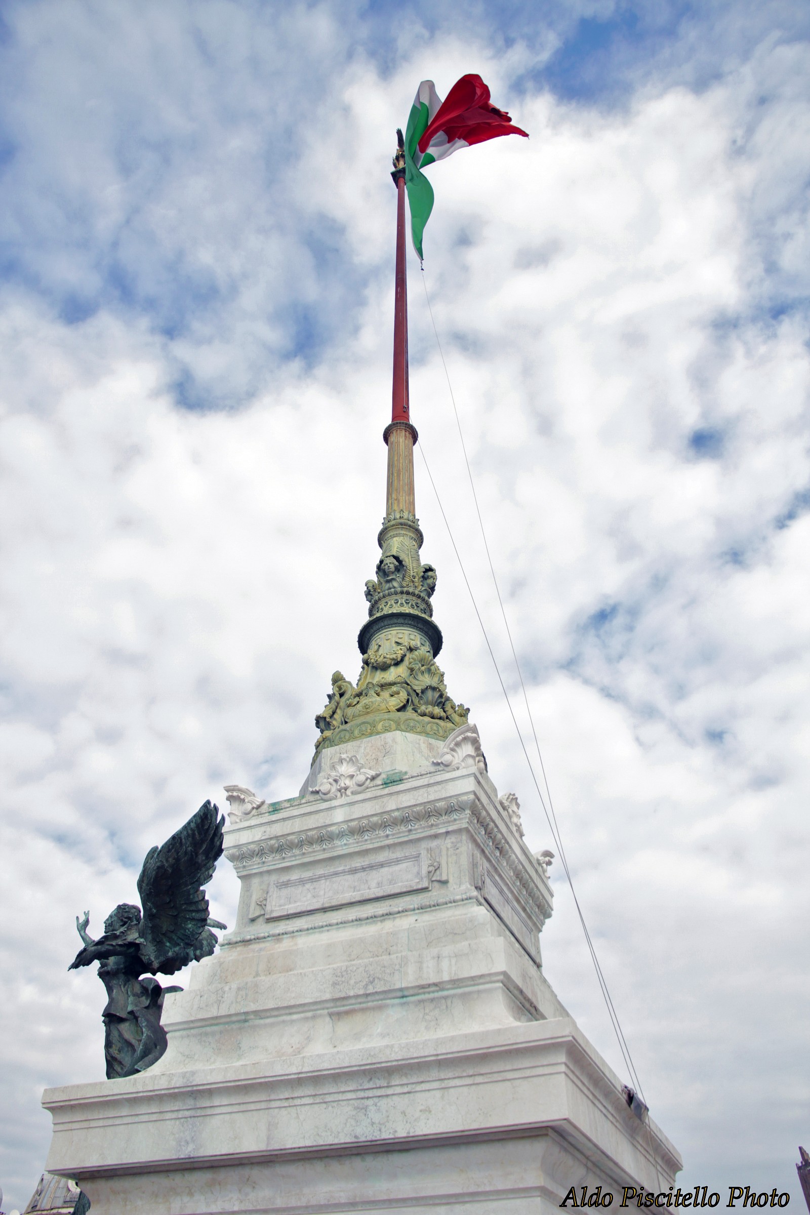 The Italian flag hoisted in a beautiful blue sky