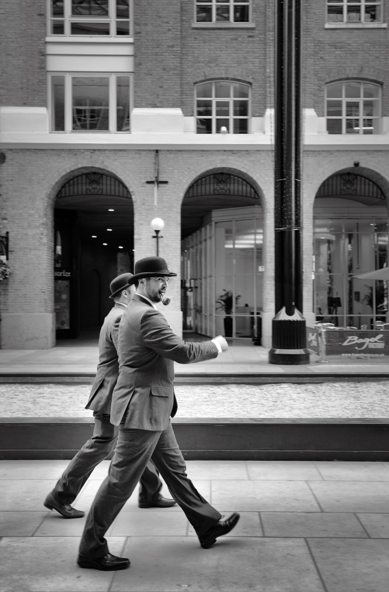Mens walking with bowler hats