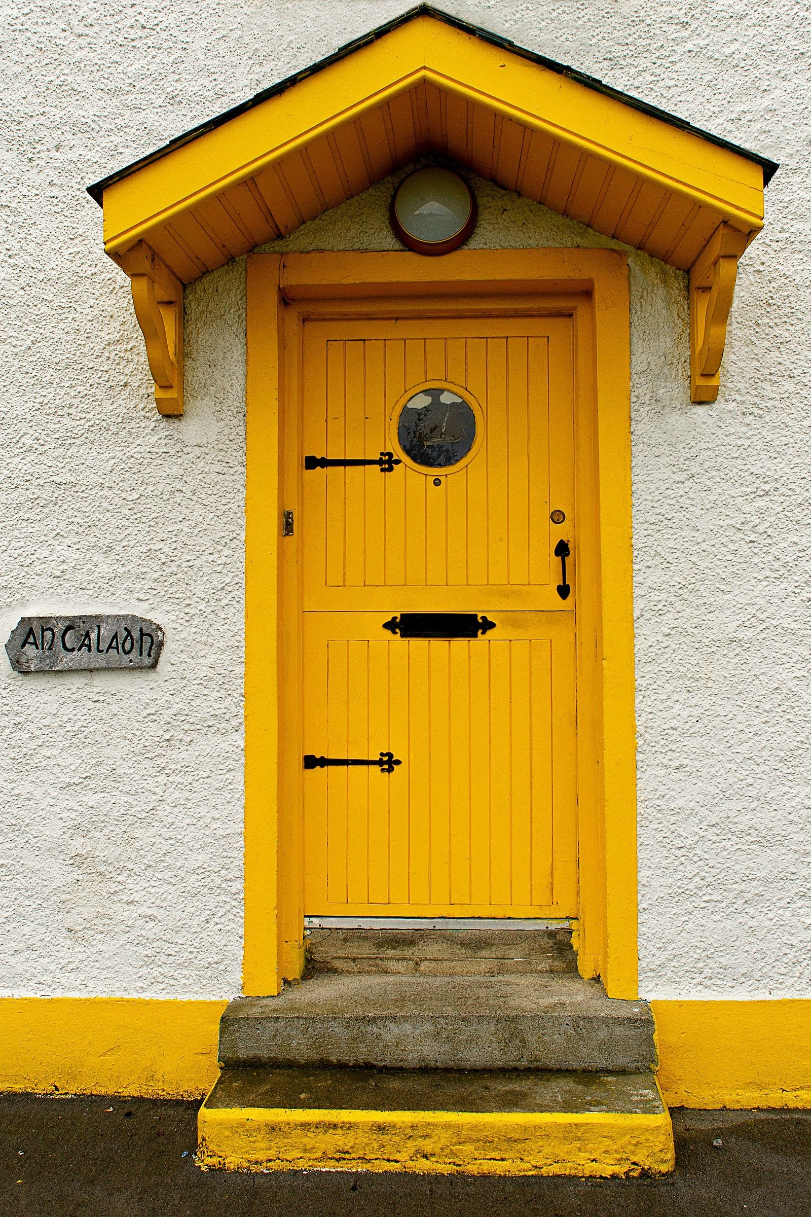 Down the street there is a yellow door (you see)