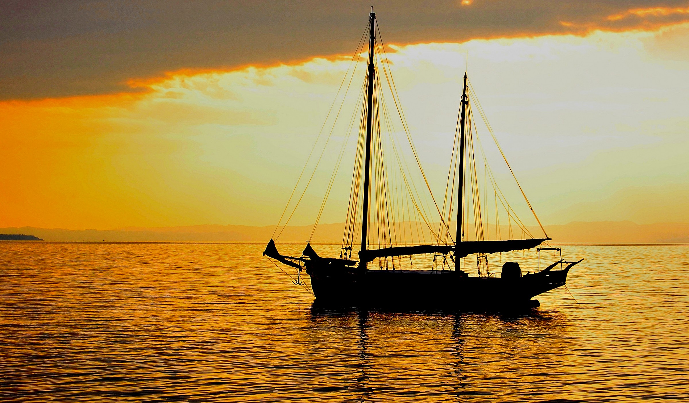sailing ship at sunset