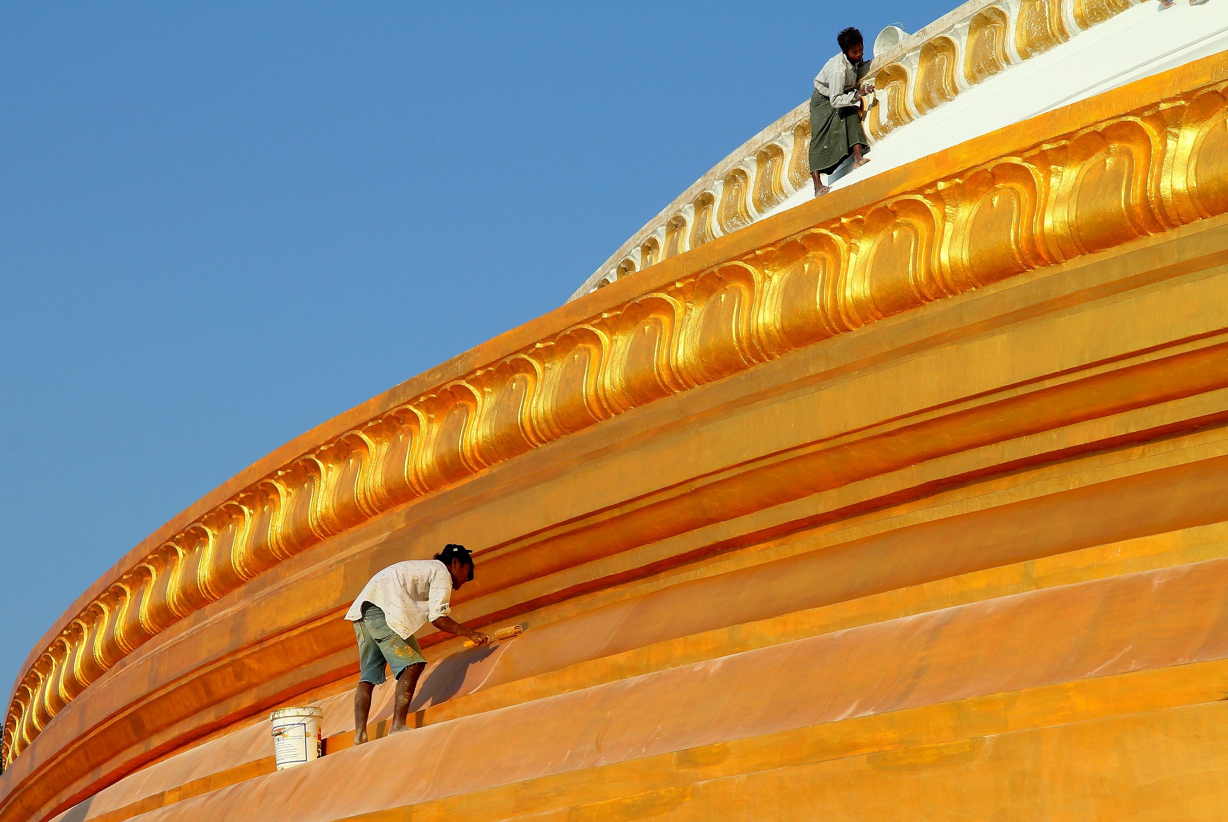 It paints the temple.