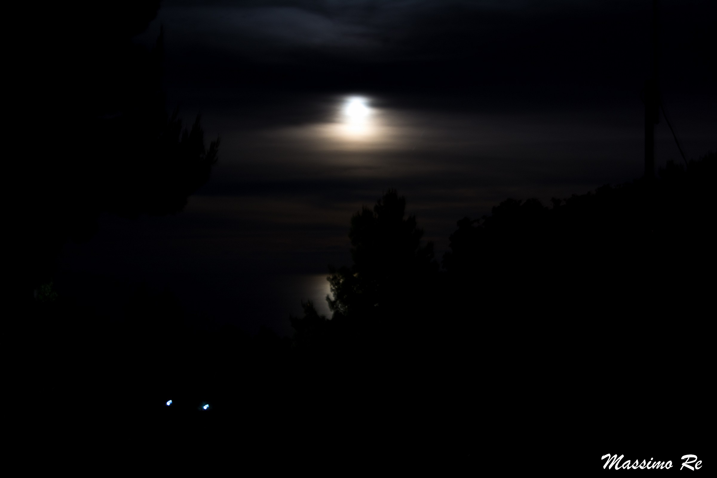 Moon with clouds over the sea
