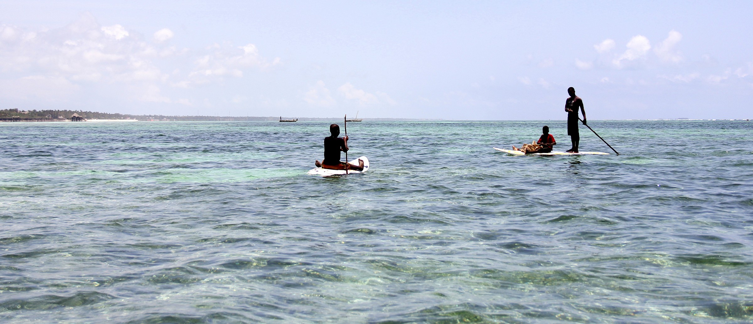 Small fishermen with surfboard