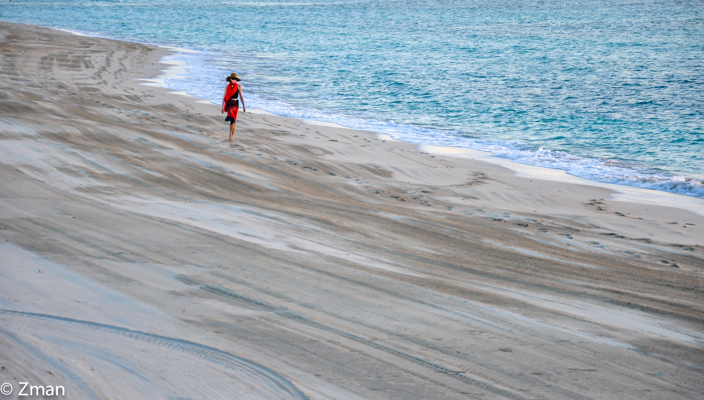 Lonely Stroller on The Beach Of The Emirates Conference