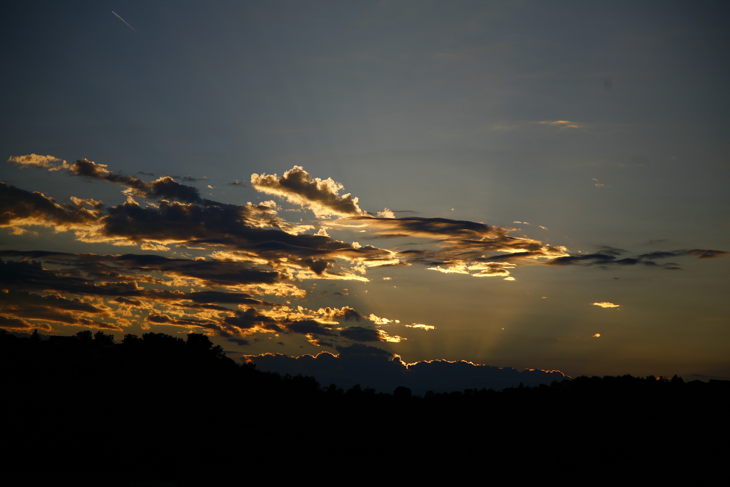 Sunset with clouds of ever-present this summer not