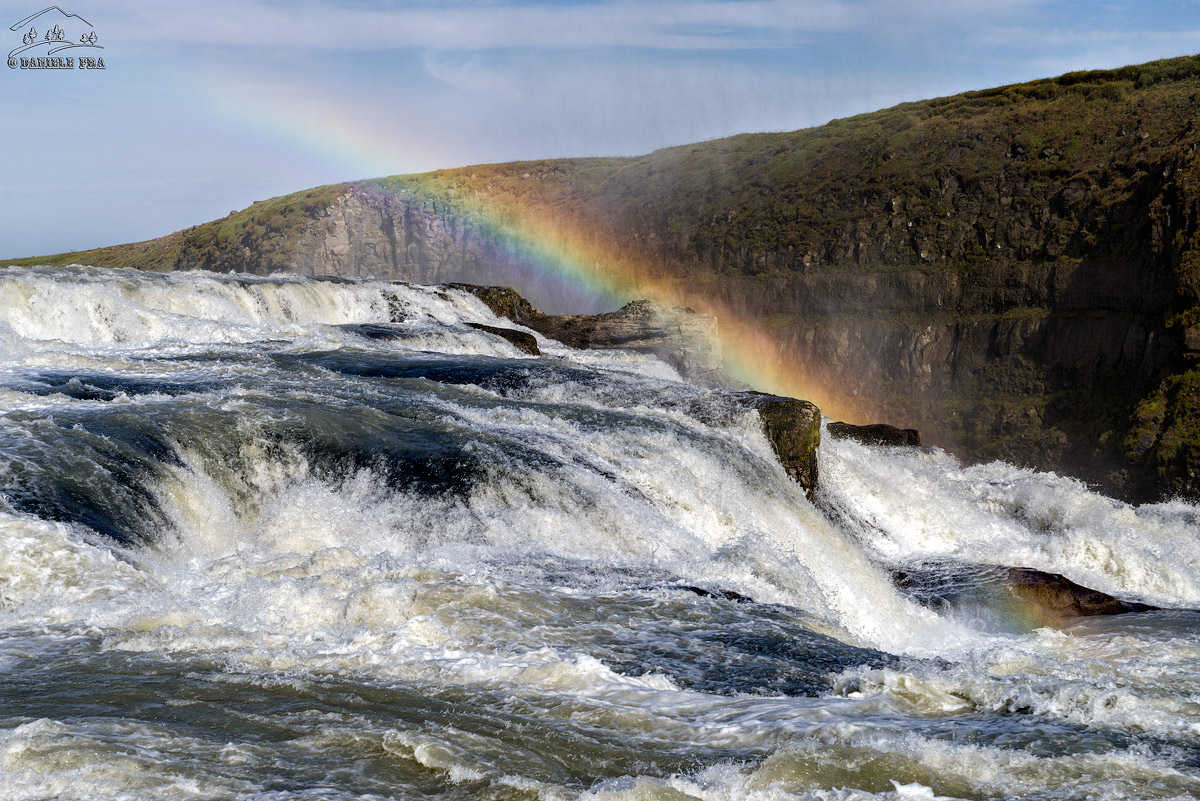 Gullfoss with rainbow on the water
