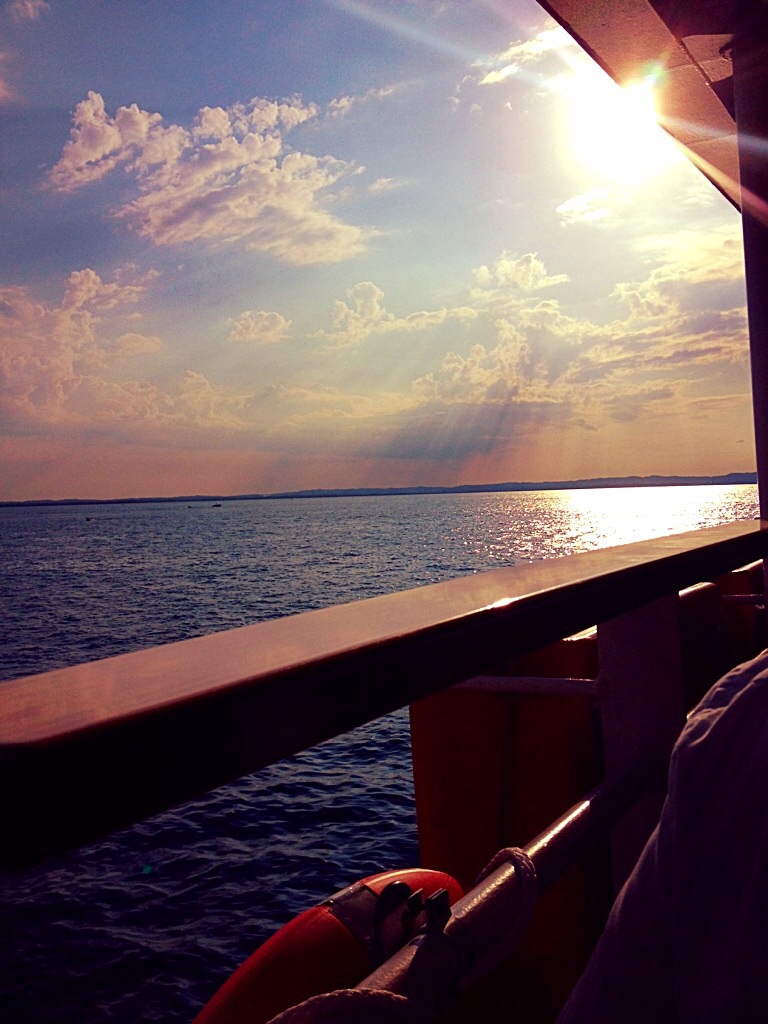 Sky with sun rays and lake