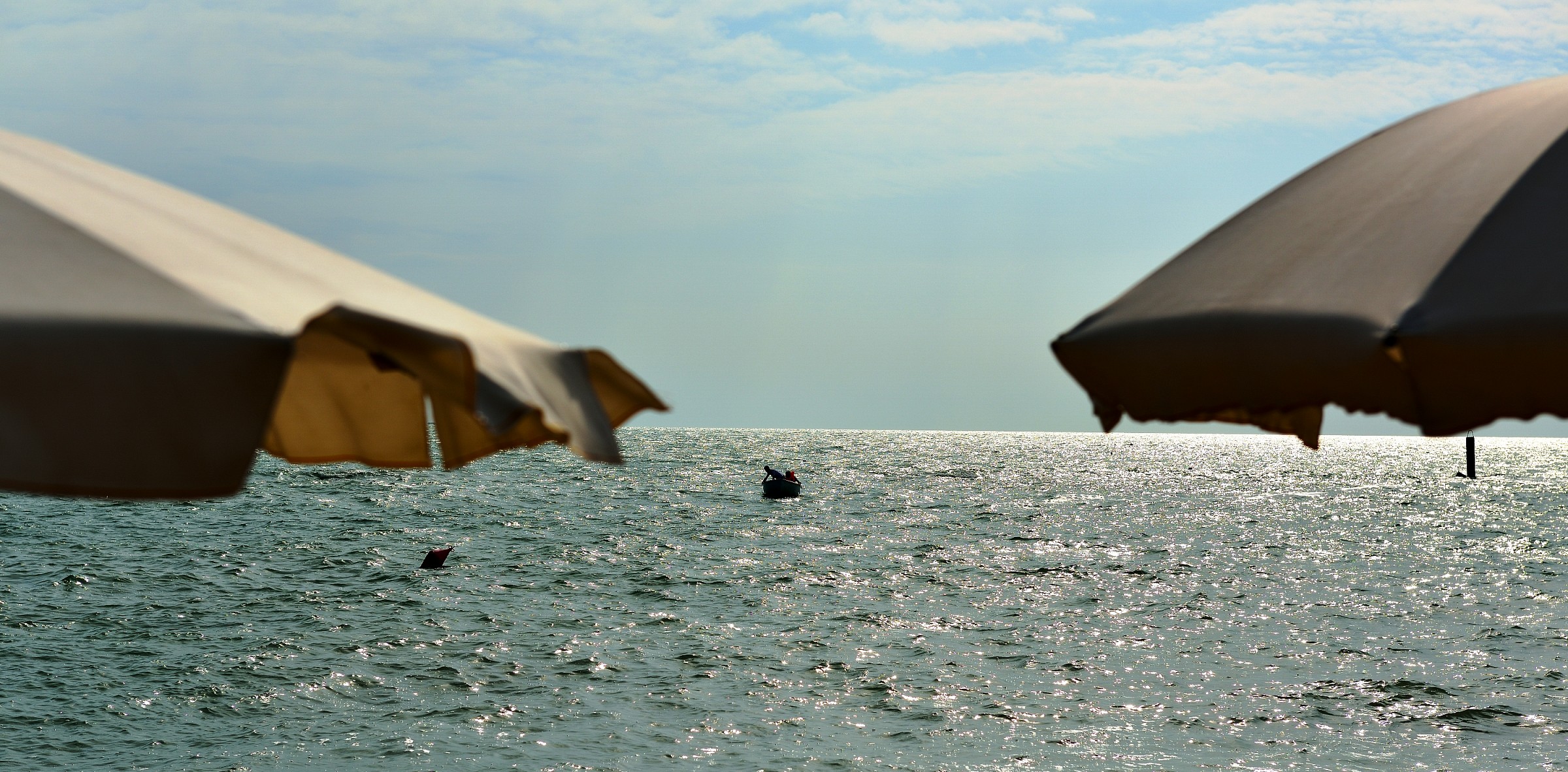 between the umbrellas