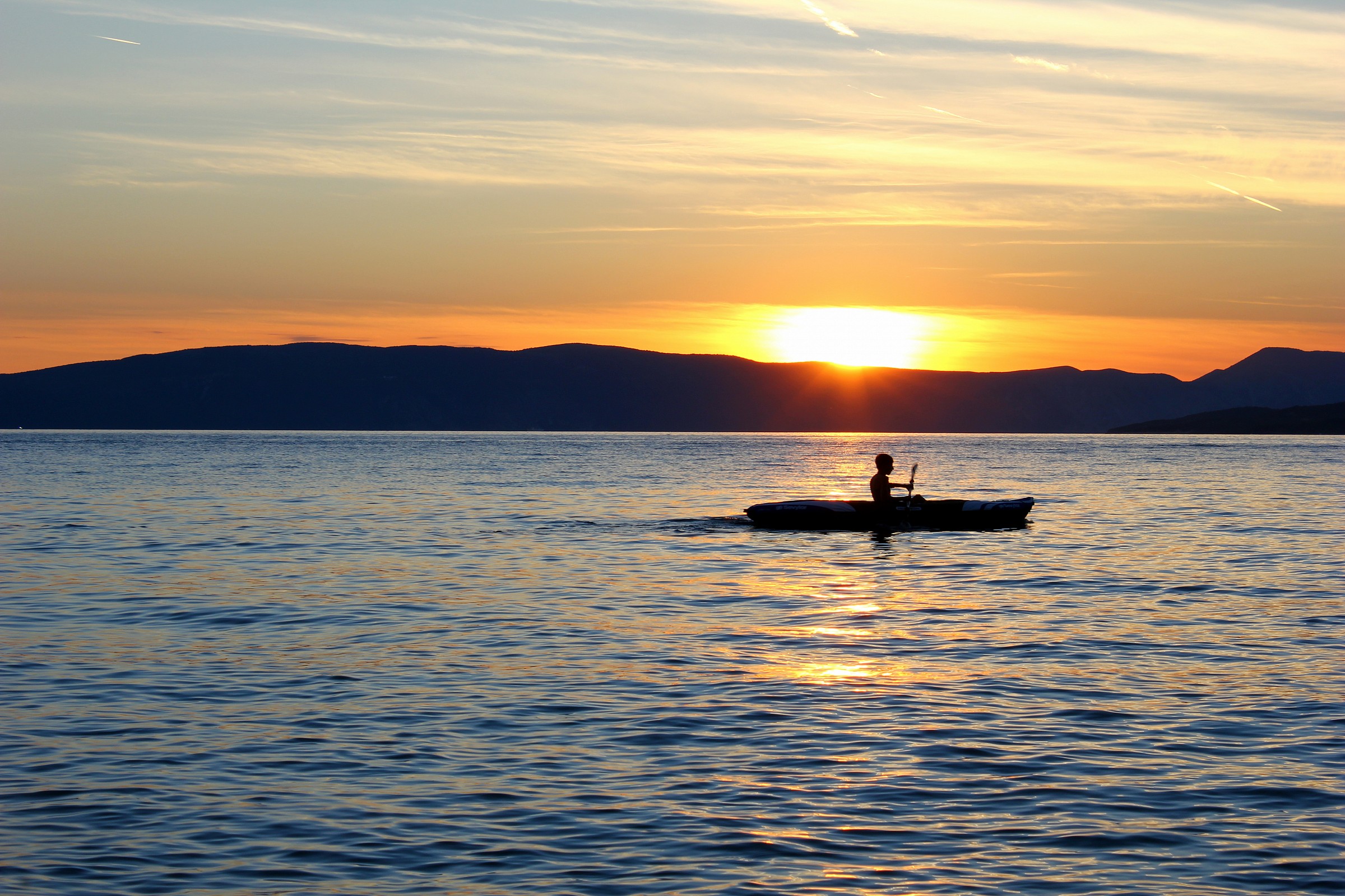 rowing at sunset