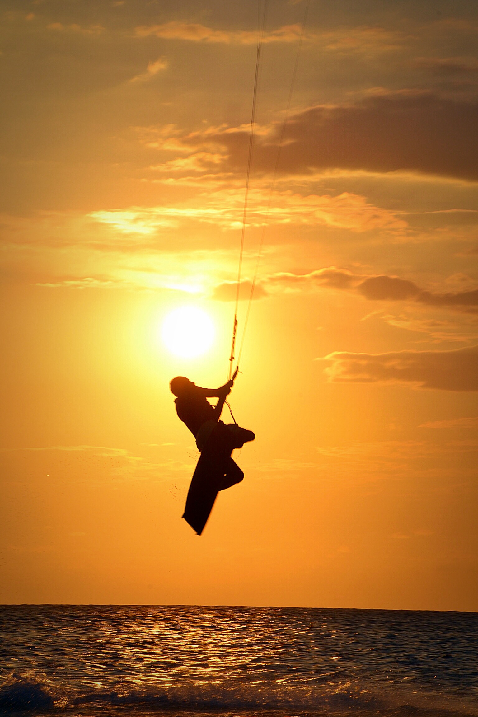 Kitesurfing at sunset