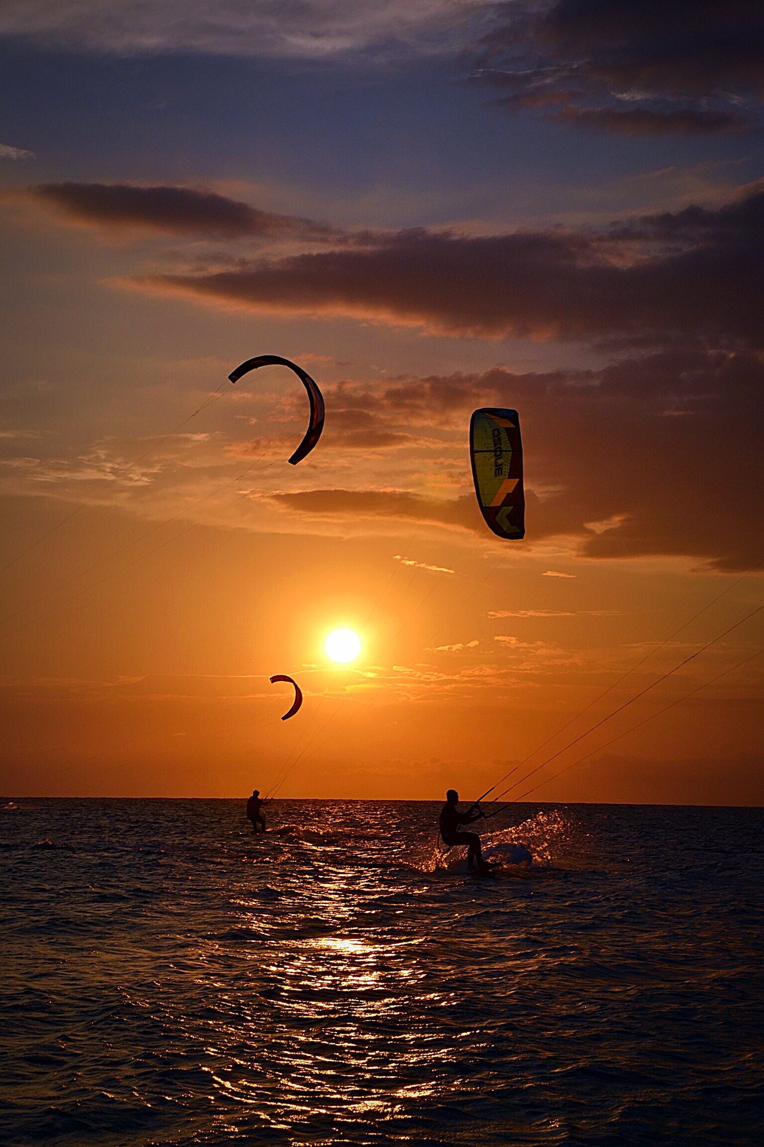 Kitesurfing at sunset
