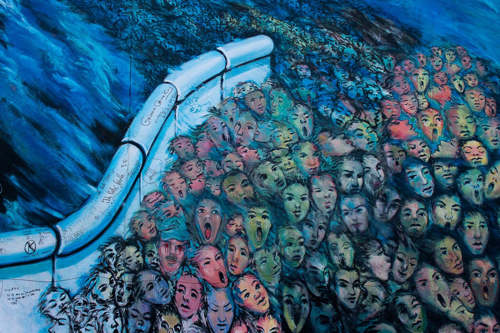 Howler faces on the Berlin Wall