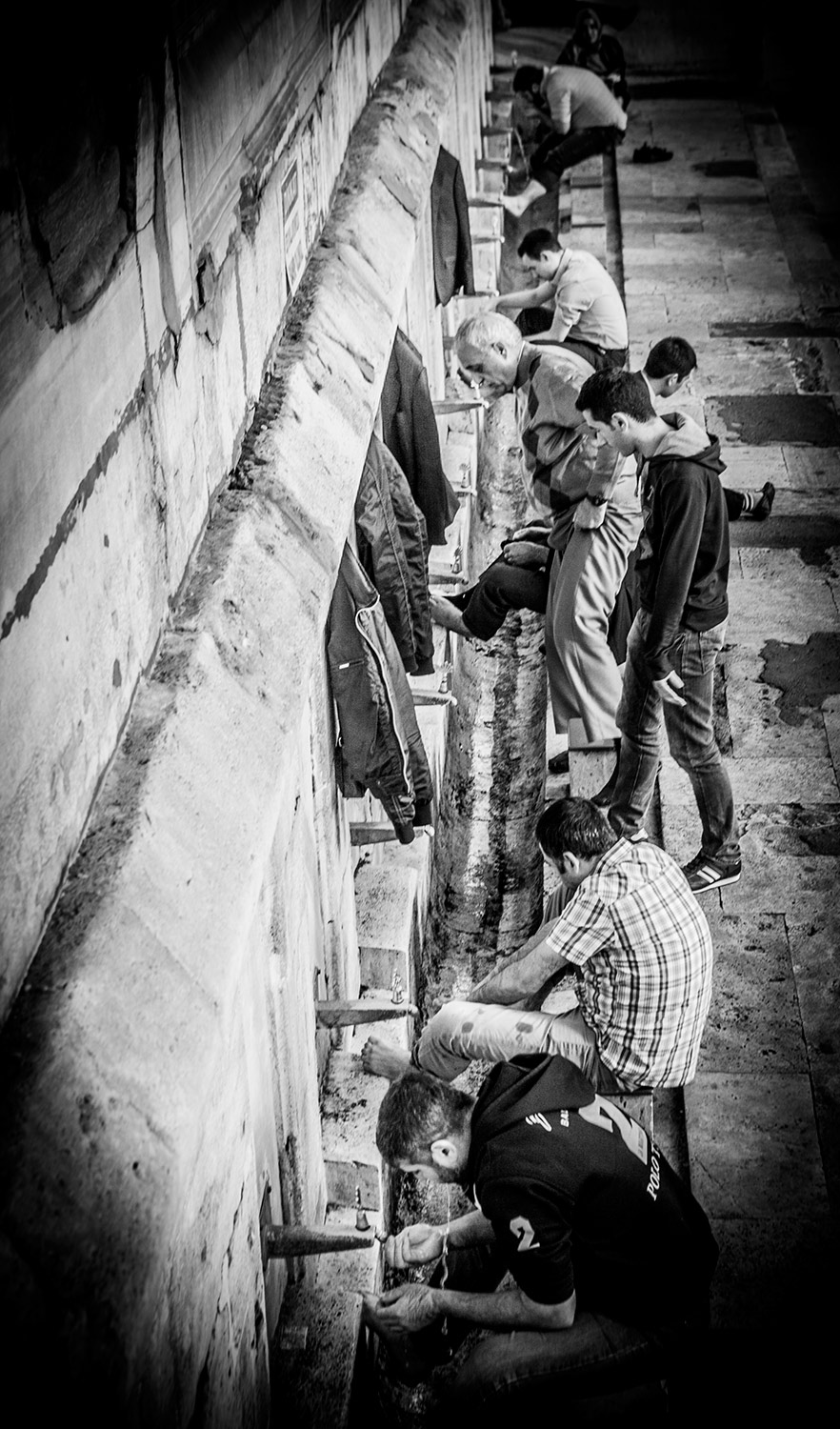 men wash before entering the mosque