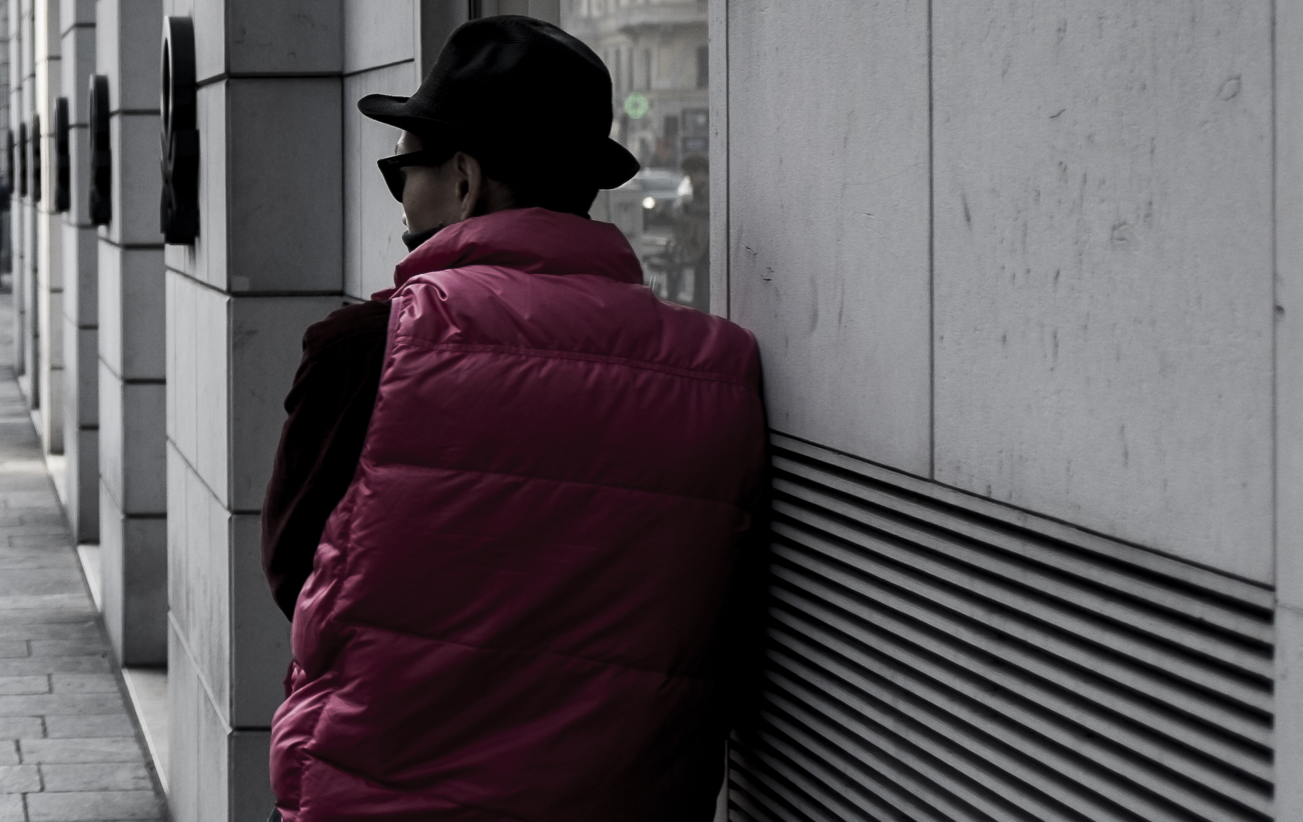 Black hat, black glasses and pink jacket