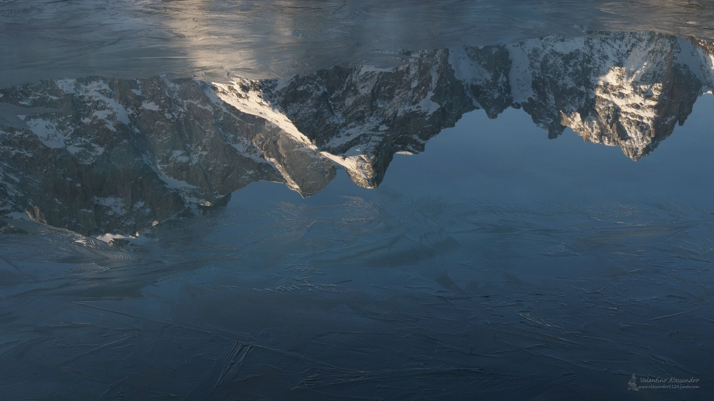 Reflections frozen in Fusine