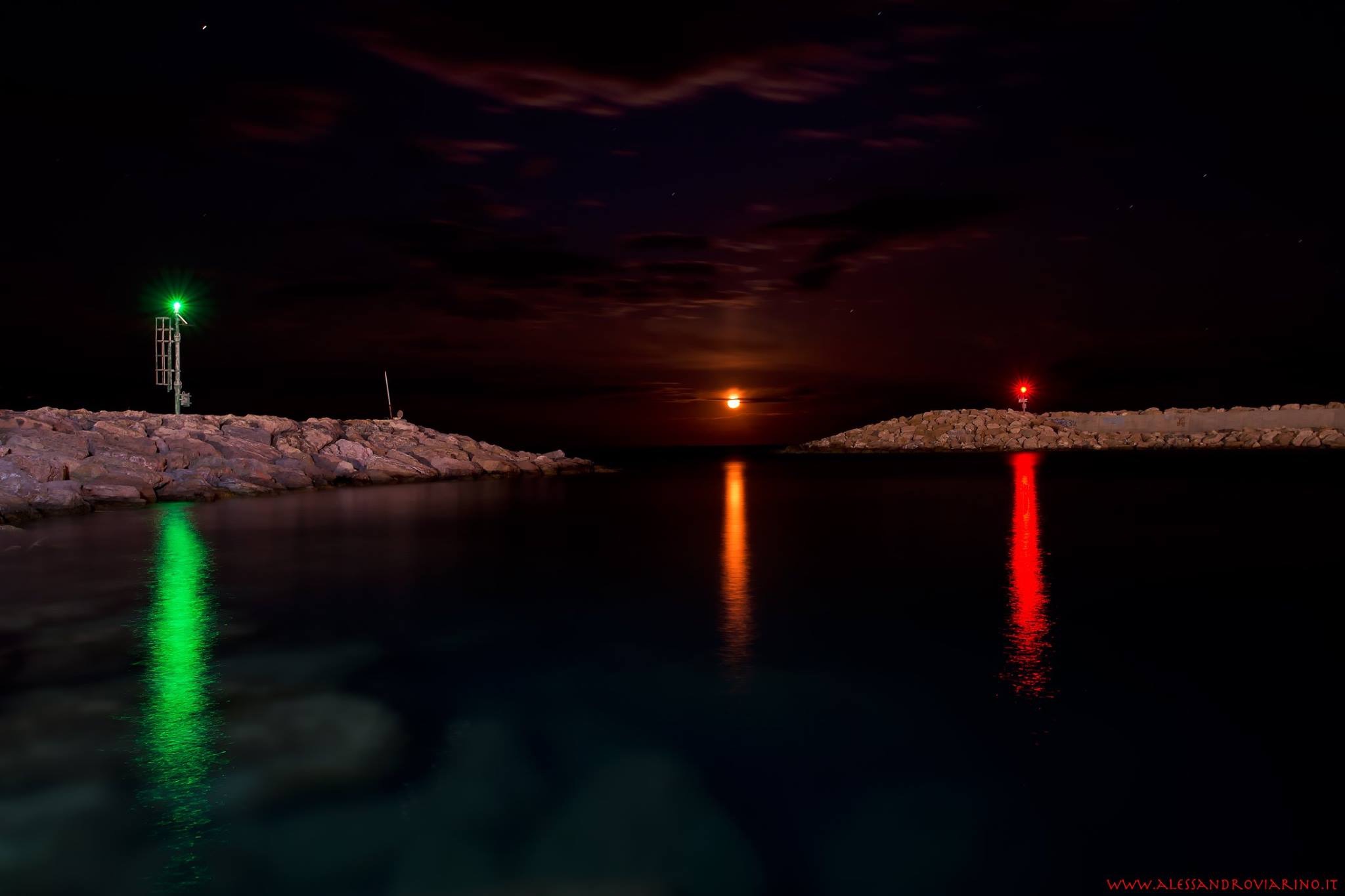 The moon and the lights of the port