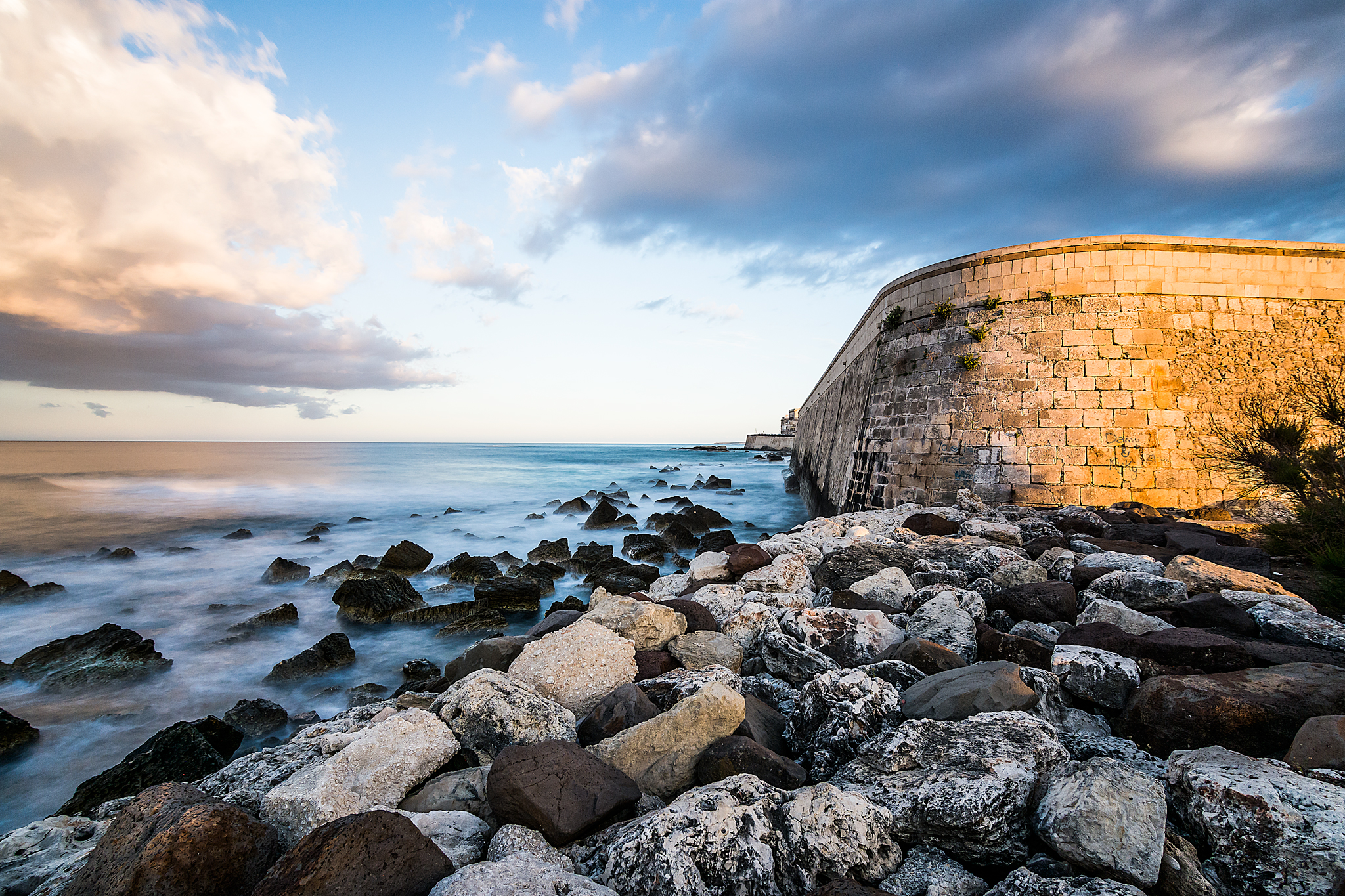 Sunset on the wall of Ortigia
