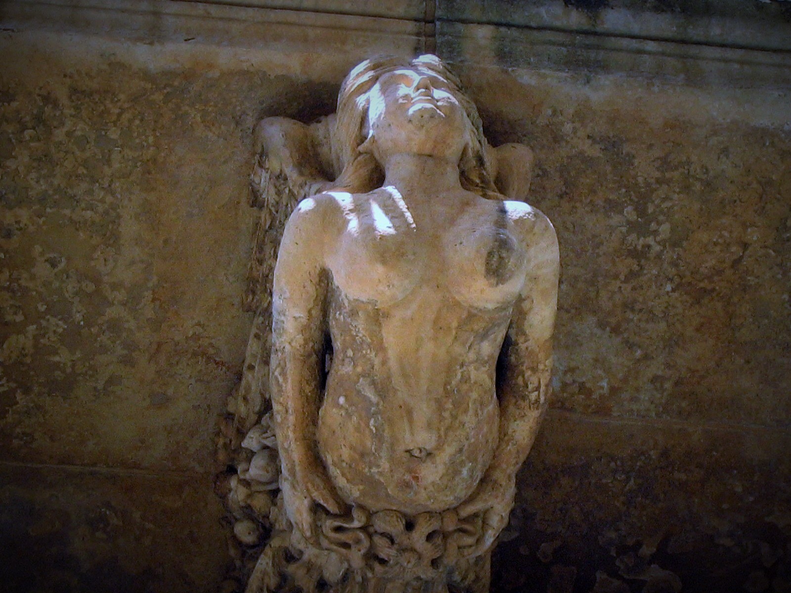 Woman under the balcony