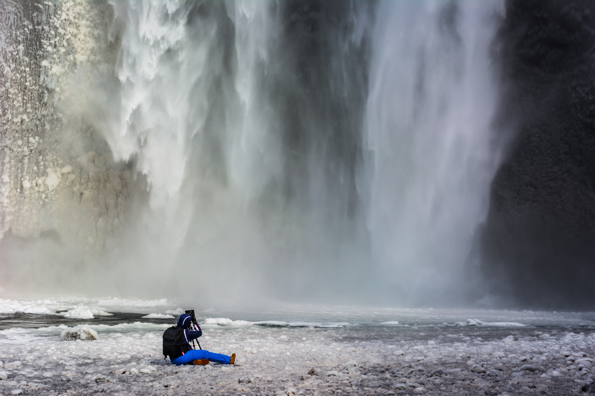 The Photographer Under the Waterfall