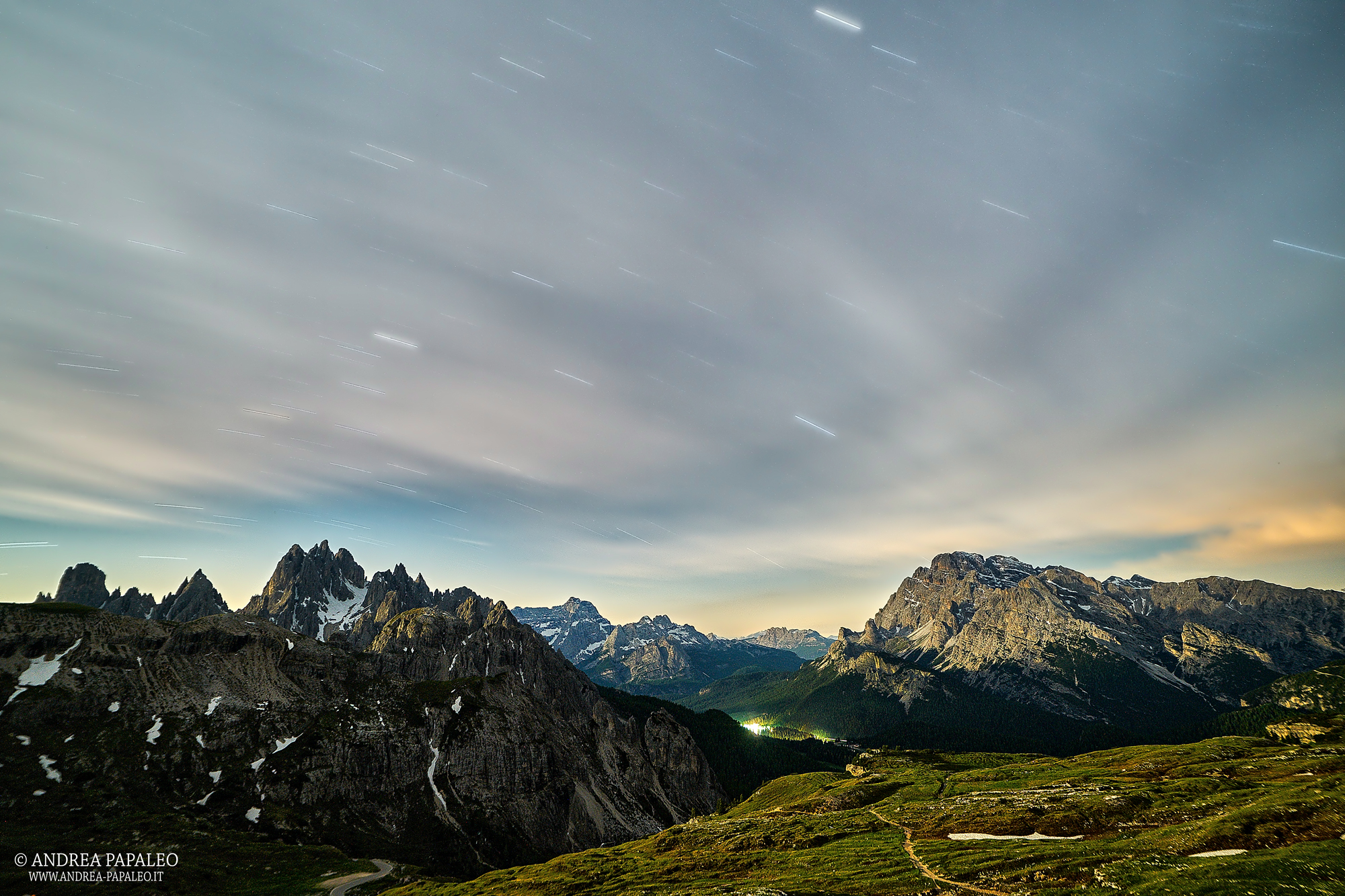Stars and clouds over the mountains.