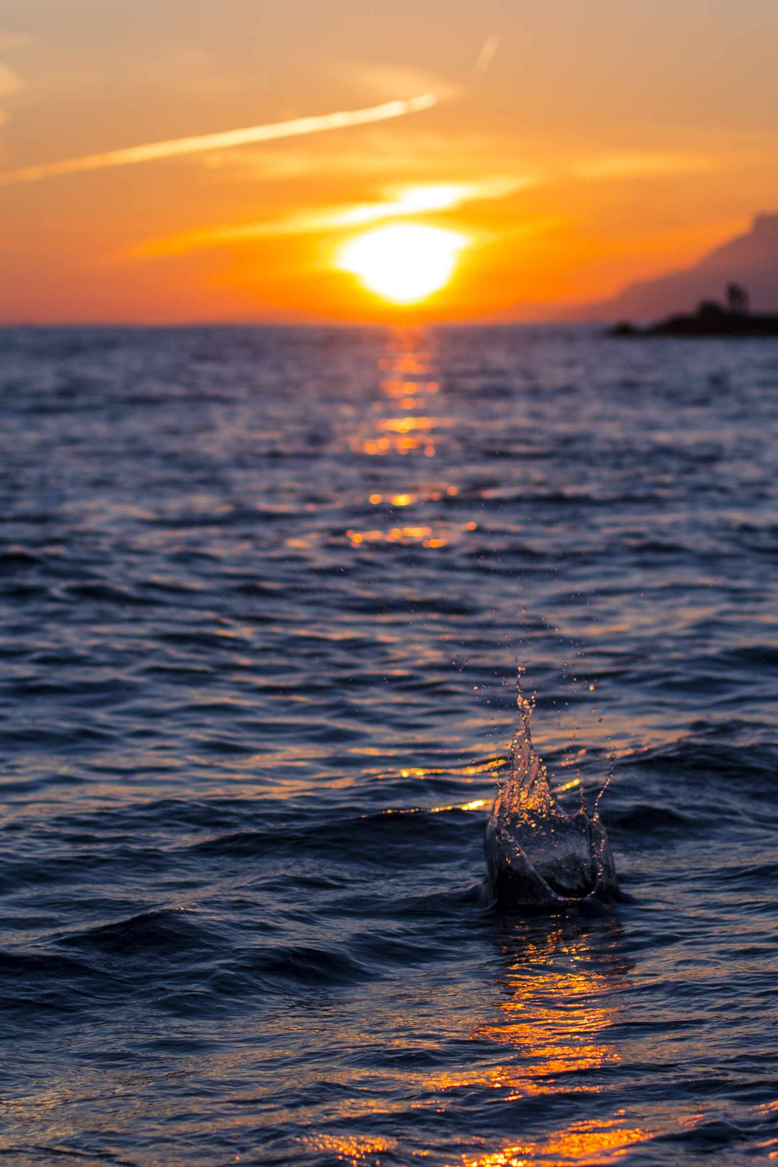 Splashing water at sunset