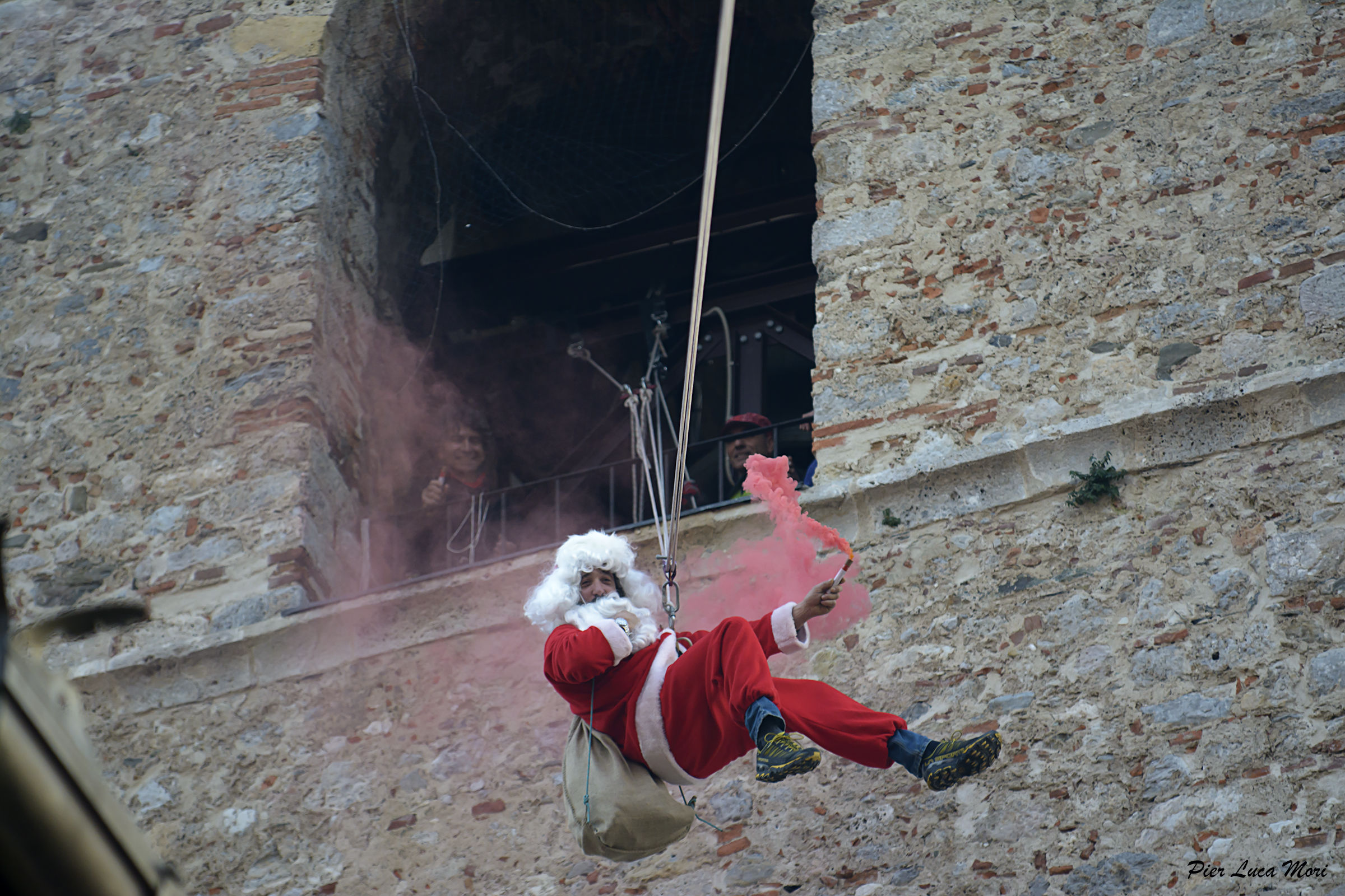 Santa Claus is coming down from the bell tower