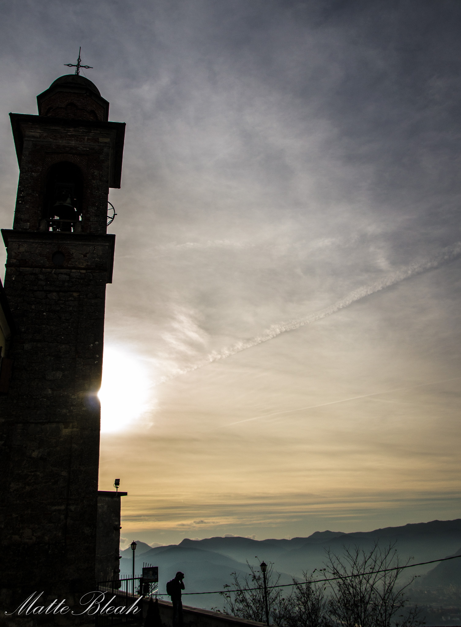 sun behind the bell tower