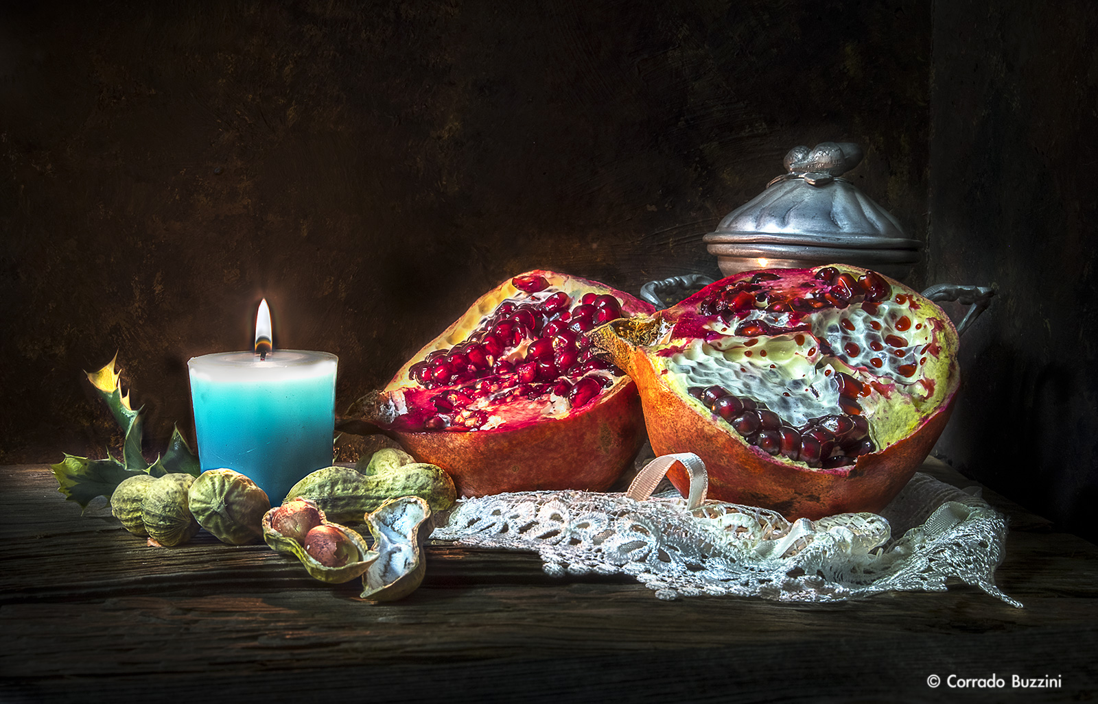 still life composition with candle and pomegranate