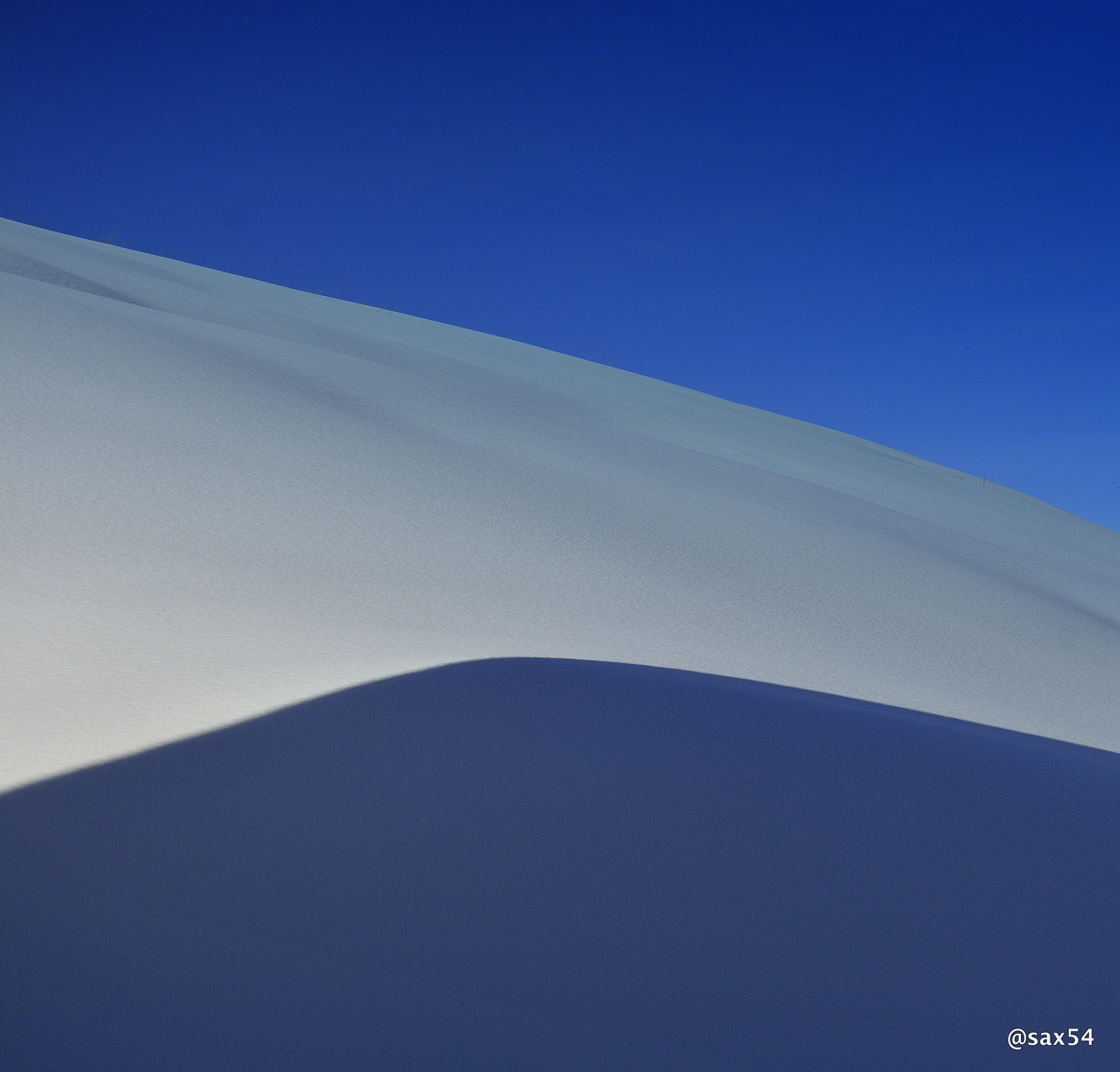 A shadow play of snow and sky