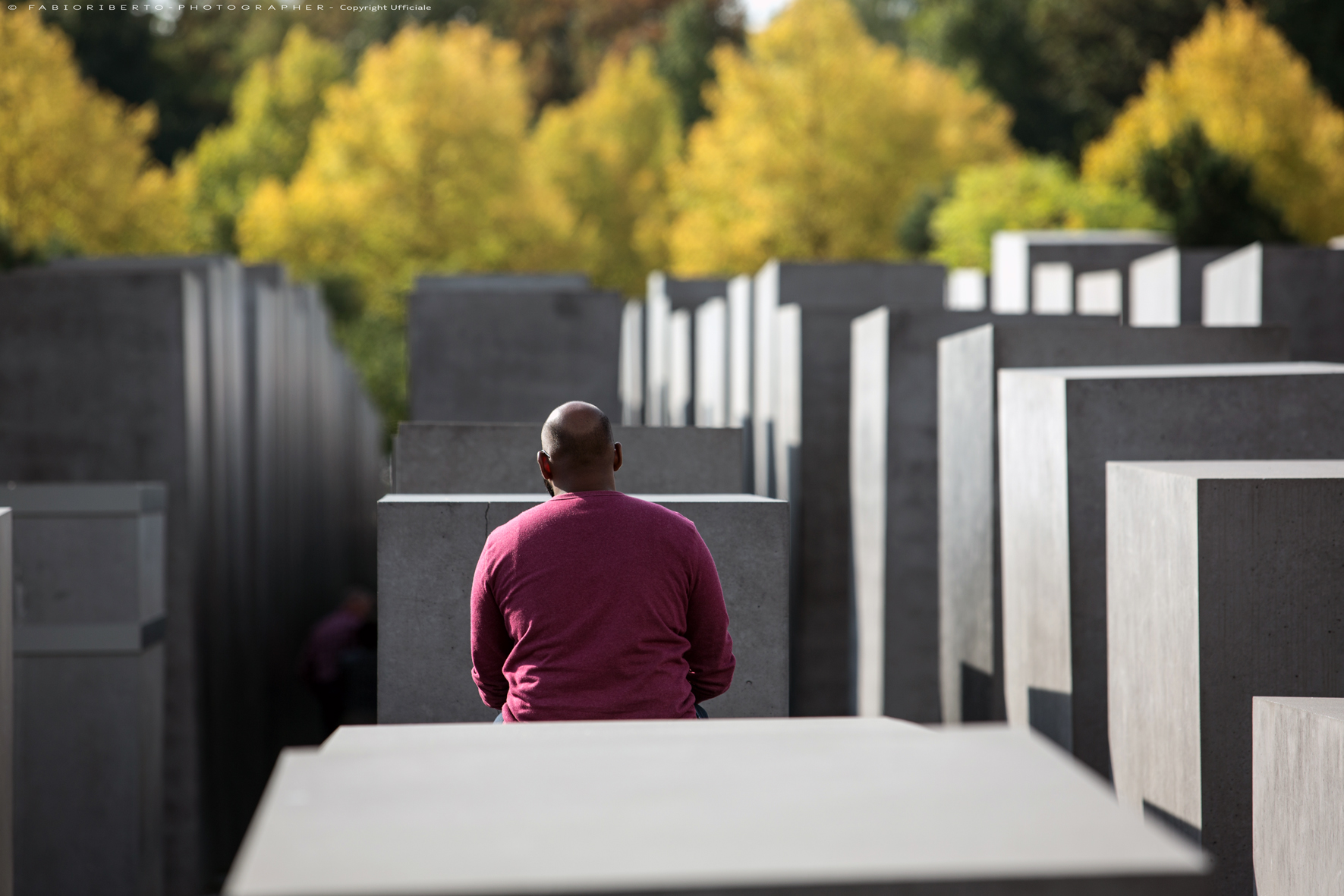 man sitting on Holocaust-Mahnmal