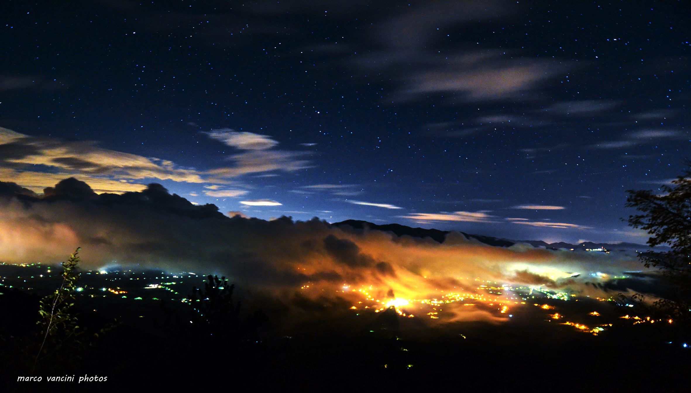 night lights shrouded by clouds