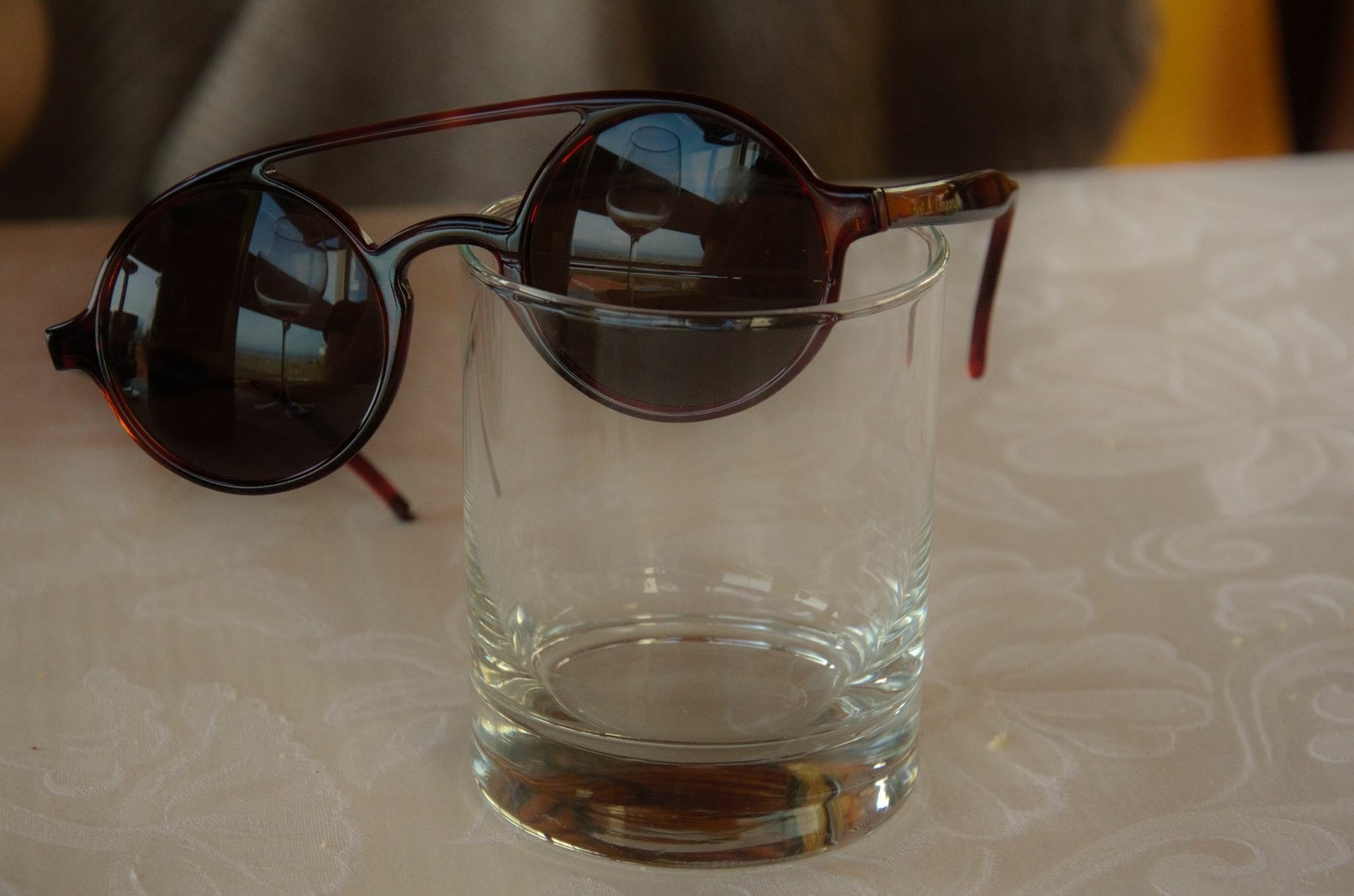 Sunglasses in the glass