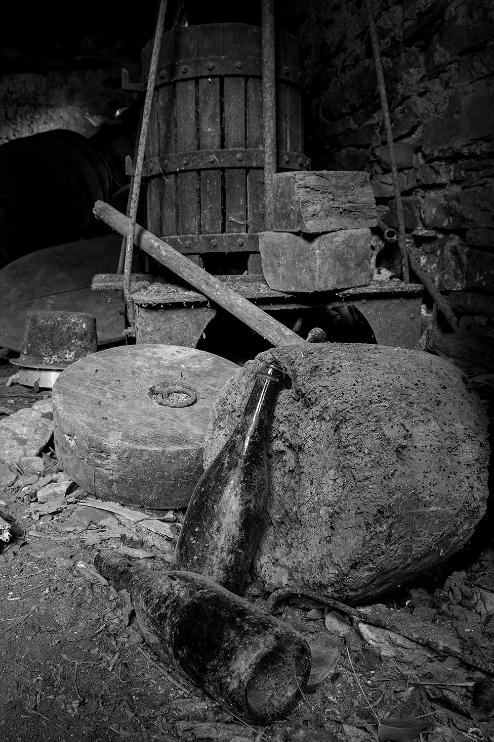 Bottles, millstones and wine press