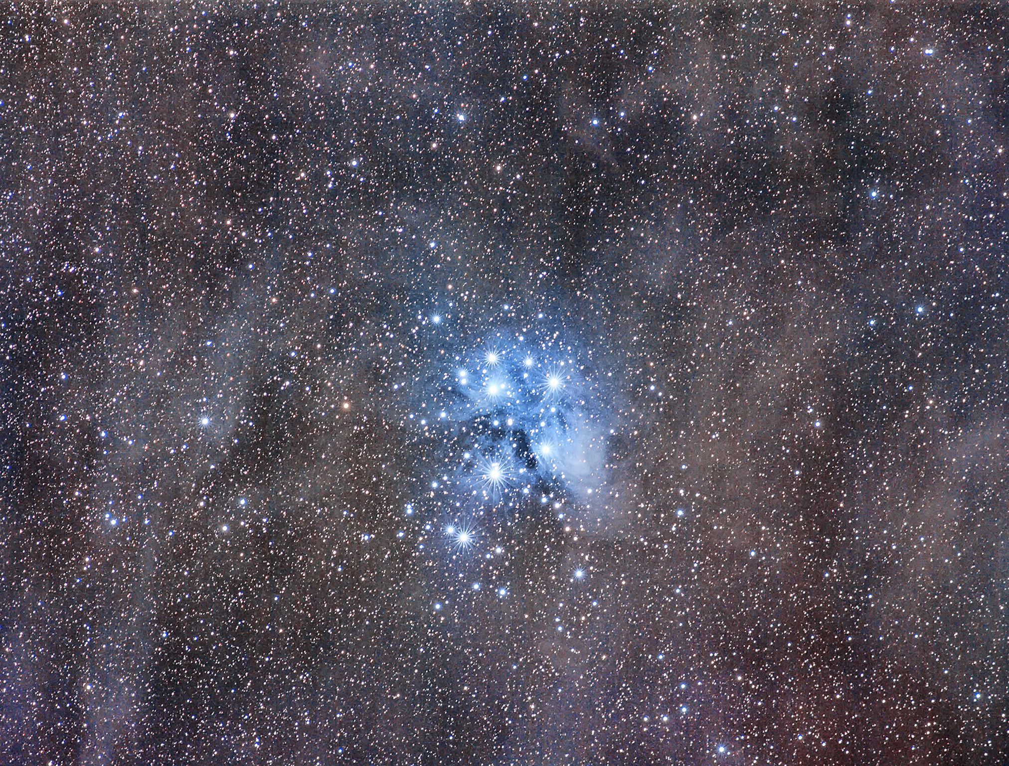 The Pleiades between the dust