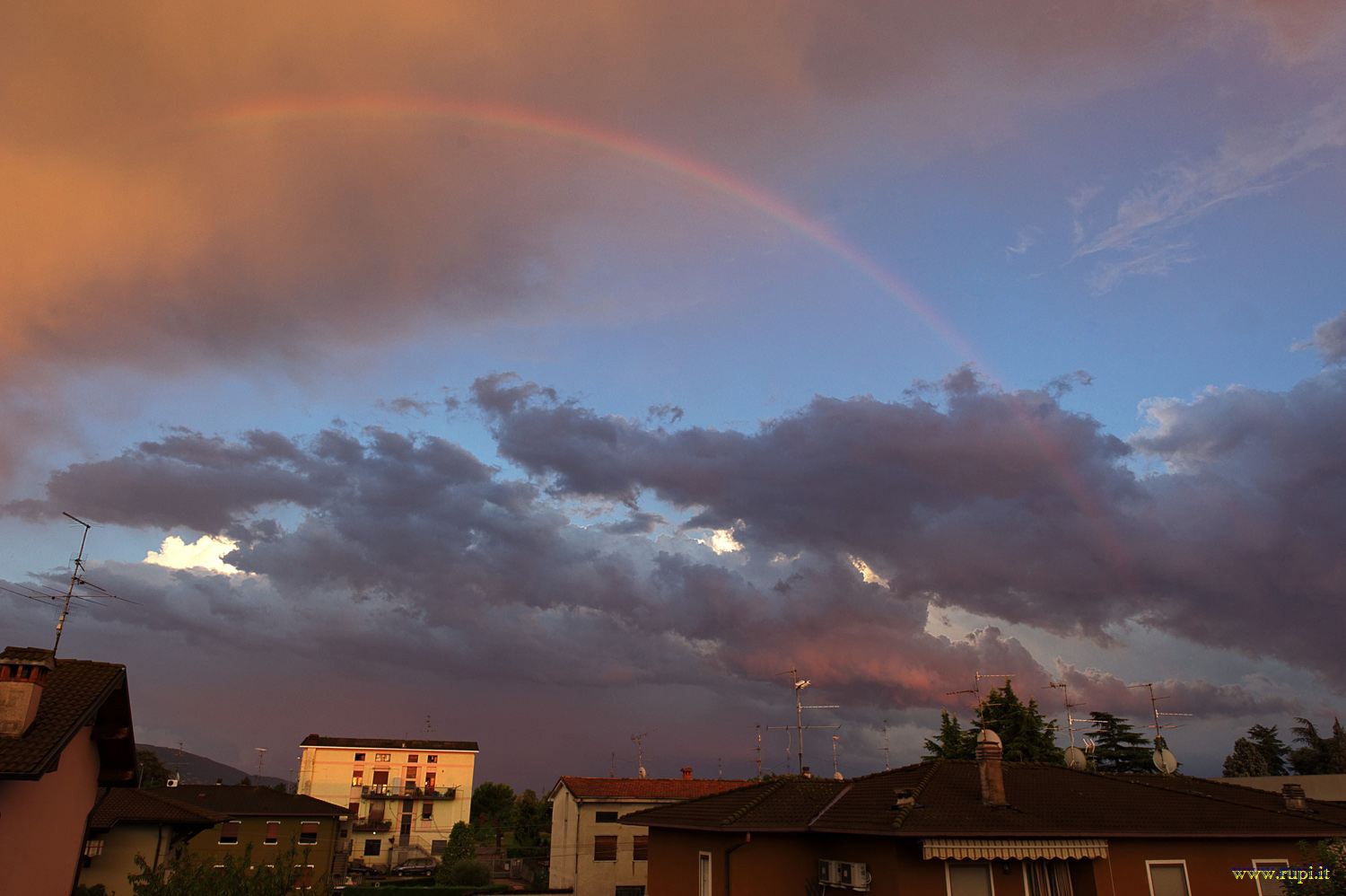 Rainbow behind the house
